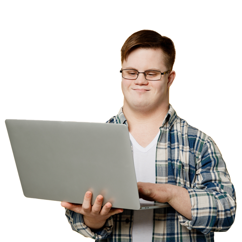 Student smiling while using a laptop